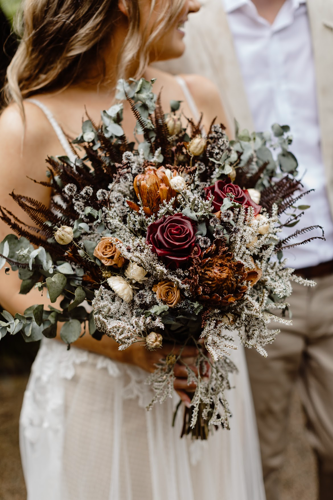 Bride holding boho chic flowers