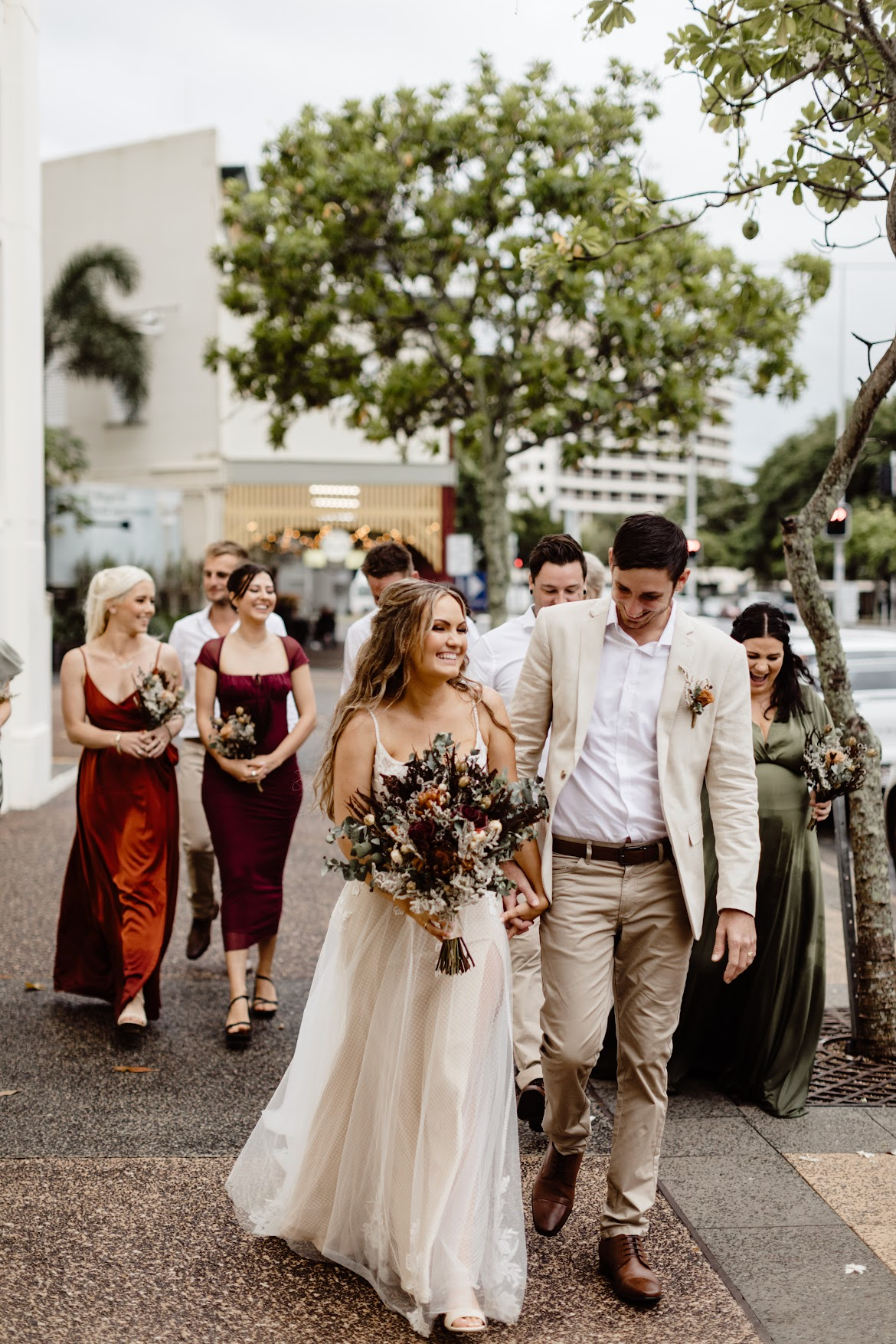 Bride and groom walking with bridal party